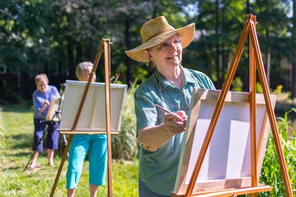 residents painting outdoors