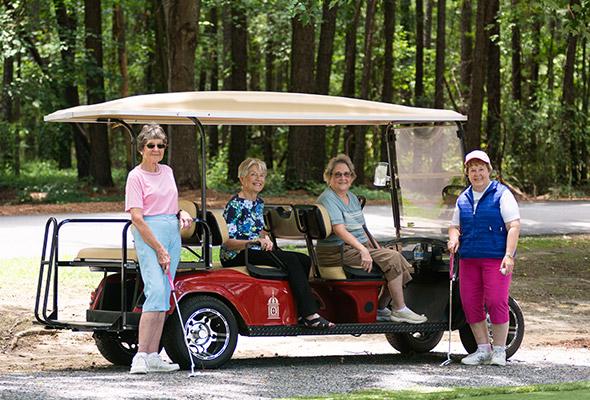 residents in golf cart